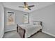 Bedroom featuring wood floors, neutral colored walls, natural light, and a ceiling fan at 10 Holden Ct, Youngsville, NC 27596