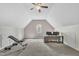 Spacious bonus room featuring plush carpeting and a ceiling fan for added comfort at 10 Holden Ct, Youngsville, NC 27596
