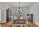 A cozy dining room features modern light fixtures, enhancing the dining experience with a touch of elegance at 10 Holden Ct, Youngsville, NC 27596