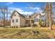 Charming two-story home with stone accents, a welcoming front porch, and a well-maintained front yard at 10 Holden Ct, Youngsville, NC 27596