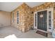 Welcoming front porch featuring stone accents, decorative details, and ample space for seating at 10 Holden Ct, Youngsville, NC 27596
