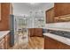 A kitchen featuring wood floors, modern appliances, ample counter space, and a breakfast bar overlooking the backyard at 10 Holden Ct, Youngsville, NC 27596