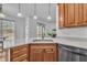 Stylish kitchen featuring white countertops, stainless steel appliances, and wooden cabinets, ideal for cooking and entertaining at 10 Holden Ct, Youngsville, NC 27596