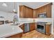Well-equipped kitchen with white countertops, stainless steel appliances, and a seamless connection to the living area at 10 Holden Ct, Youngsville, NC 27596