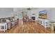 Bright living room with hardwood flooring, a fireplace, and comfortable seating for relaxing and entertaining at 10 Holden Ct, Youngsville, NC 27596