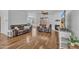 Spacious living room featuring hardwood floors, a cozy fireplace, and comfortable seating with ample natural light at 10 Holden Ct, Youngsville, NC 27596