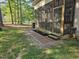 A screened porch with access to a backyard and patio offers space to enjoy the outdoors with comfort at 10 Holden Ct, Youngsville, NC 27596
