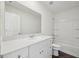 A bathroom showcases a white vanity, toilet and a tub with a shower head at 103 Gabriel Ct, Clayton, NC 27520