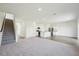 Open floor plan showcasing a kitchen, living room, and stairway at 103 Gabriel Ct, Clayton, NC 27520