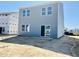 New construction backyard with a sliding glass door and gray vinyl siding at 105 Gabriel Ct, Clayton, NC 27520
