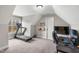 Bedroom space featuring a treadmill, desk, shelves, and view from a large window at 105 Shawnee Drive, Louisburg, NC 27549