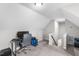 Bonus room featuring carpet floors, gray walls, and a desk setup at 105 Shawnee Drive, Louisburg, NC 27549