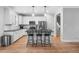 Modern kitchen with white cabinetry, stainless steel appliances, and a central island at 105 Shawnee Drive, Louisburg, NC 27549
