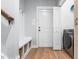 Mudroom featuring storage bench, storage cubbies, luxury vinyl floors, and washer/dryer hookups at 105 Shawnee Drive, Louisburg, NC 27549