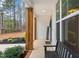 Inviting front porch with wooden pillars and a bench, creating a welcoming entrance to the home at 105 Shawnee Drive, Louisburg, NC 27549