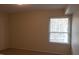 Bedroom featuring neutral carpet, neutral colored walls, window with blinds and interior doors at 108 Ephesus Church Rd # Apt 512, Chapel Hill, NC 27517