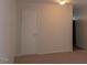 Neutral living room featuring neutral carpet, neutral colored walls, ceiling light and interior doors at 108 Ephesus Church Rd # Apt 512, Chapel Hill, NC 27517