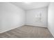 Bright, carpeted bedroom offers a serene and comfortable living space at 1103 Freestone Rd, Durham, NC 27703