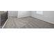 Hallway with neutral carpeting and railing offers a view into another room at 1103 Freestone Rd, Durham, NC 27703