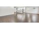 Spacious living area with hardwood floors, connected to kitchen area featuring a large island at 1103 Freestone Rd, Durham, NC 27703