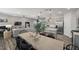 Open-concept dining area with modern decor, adjacent to a kitchen with stainless steel appliances and a cozy living room at 1113 Freestone Rd, Durham, NC 27703