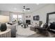 Inviting living room with a fireplace, large windows, neutral tones, comfortable seating, and modern decor at 1113 Freestone Rd, Durham, NC 27703