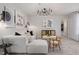 Cozy living area with a white sofa, modern lighting, decorative art, and a stylish decor at 1113 Freestone Rd, Durham, NC 27703