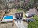 Aerial shot shows a pool area, detached garage, spacious yard, and a well-maintained deck at 112 Hartland Ct, Raleigh, NC 27614