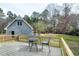 This backyard features a lovely new back deck with a table and chairs, perfect for relaxing at 112 Hartland Ct, Raleigh, NC 27614