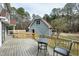 This backyard features a lovely new back deck with a table and chairs, perfect for relaxing at 112 Hartland Ct, Raleigh, NC 27614
