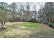This home has a spacious backyard surrounded by beautiful, mature trees at 112 Hartland Ct, Raleigh, NC 27614
