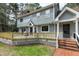 Spacious wooden deck accessible from main level with brick stairs to the backyard at 112 Hartland Ct, Raleigh, NC 27614