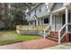 Spacious wooden deck accessible from main level with brick stairs to the backyard at 112 Hartland Ct, Raleigh, NC 27614