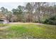 This home has a spacious backyard and in-ground pool surrounded by beautiful, mature trees at 112 Hartland Ct, Raleigh, NC 27614