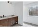 Bright bathroom with dual sinks, granite countertop, and stylish fixtures at 112 Hartland Ct, Raleigh, NC 27614