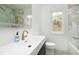Bright bathroom with white countertops, modern fixtures and luxury finishes at 112 Hartland Ct, Raleigh, NC 27614