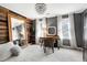 Stylish bedroom boasts natural light, wood accent wall, and decorative chandelier at 112 Hartland Ct, Raleigh, NC 27614
