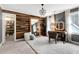 Bedroom features wood accent wall, chandelier, and doorway to the walk-in closet at 112 Hartland Ct, Raleigh, NC 27614