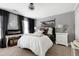 Bedroom with a plush bed, modern furnishings and sophisticated decorations at 112 Hartland Ct, Raleigh, NC 27614