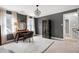 Comfortable bedroom with decor chandelier, desk, and walk-in closet at 112 Hartland Ct, Raleigh, NC 27614