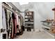 Walk-in closet features ample clothing storage and a decorative chandelier at 112 Hartland Ct, Raleigh, NC 27614