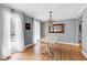 Elegant dining room with hardwood floors, chandelier, and ample natural light at 112 Hartland Ct, Raleigh, NC 27614