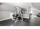 Well-lit exercise room with rubber flooring and an additional office space at 112 Hartland Ct, Raleigh, NC 27614
