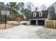 Detached two-car garage with basketball hoop, storage, and spacious driveway at 112 Hartland Ct, Raleigh, NC 27614