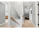 Upstairs hallway showcasing access to various rooms and carpeted floors at 112 Hartland Ct, Raleigh, NC 27614