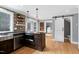 Charming kitchen featuring a large island, stainless steel appliances, and hardwood floors at 112 Hartland Ct, Raleigh, NC 27614