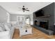 Inviting living room featuring hardwood floors, fireplace, and ample seating at 112 Hartland Ct, Raleigh, NC 27614