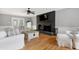 Inviting living room featuring hardwood floors, fireplace, and ample seating at 112 Hartland Ct, Raleigh, NC 27614