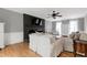 Bright living room boasts hardwood floors, fireplace, and ample seating at 112 Hartland Ct, Raleigh, NC 27614