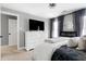 Bright main bedroom with neutral color palette and decorative electric fireplace at 112 Hartland Ct, Raleigh, NC 27614